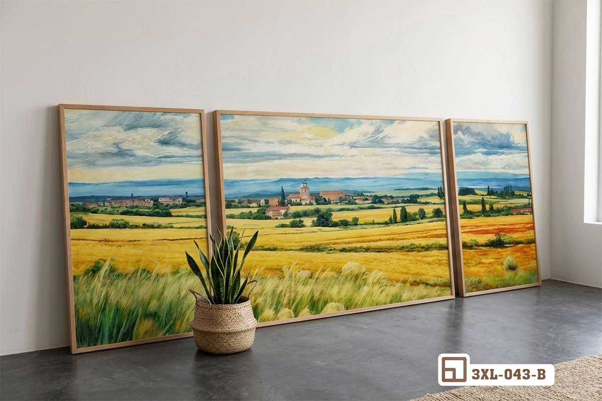 tranh đồng quê ba tấm dựng sát sàn nhà nền tối Bộ tranh phong cảnh đồng quê ba tấm được dựng sát sàn nhà tối với điểm nhấn cây xương rồng xanh mát bên cạnh