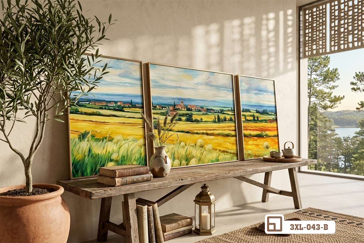 tranh đồng quê bố trí trên bàn gỗ dài dưới ánh nắng Bộ tranh phong cảnh đồng quê bố trí trên bàn gỗ dài ngập tràn ánh nắng chiếu qua khung cửa sổ lớn