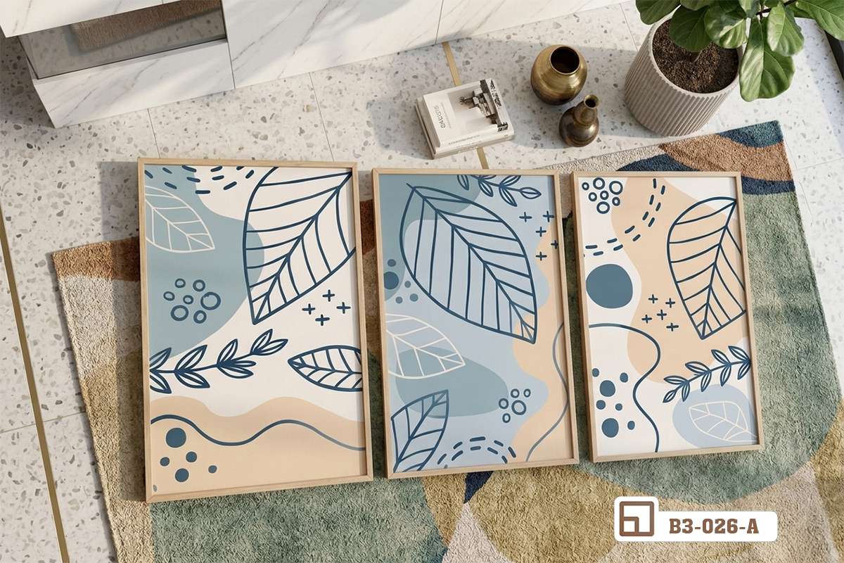tranh lá cây hiện đại bố cục ngang trải thảm sang trọng dưới ánh nắng chiếu nghiêng Cận cảnh bộ tranh lá cây hiện đại trải phẳng trên thảm phòng khách dưới nắng vàng