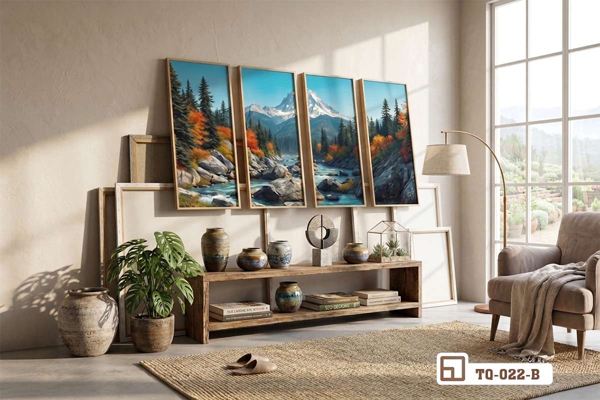 bộ tranh phong cảnh thiên nhiên bốn tấm tựa góc tường cạnh kệ gỗ thấp và ghế bành thư giãn ấm cúng Cận cảnh bộ tranh phong cảnh thiên nhiên tựa trên sàn gỗ bên cạnh kệ tủ trang trí và ánh sáng tự nhiên chiếu rọi