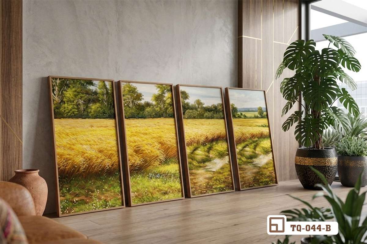 tranh phong cảnh đồng quê đặt tựa sàn nhà cạnh chậu cây xanh phòng khách Bộ tranh phong cảnh đồng quê khổ lớn tựa hững hờ dưới sàn nhà cạnh góc cây xanh trong phòng khách hiện đại tràn ngập ánh sáng